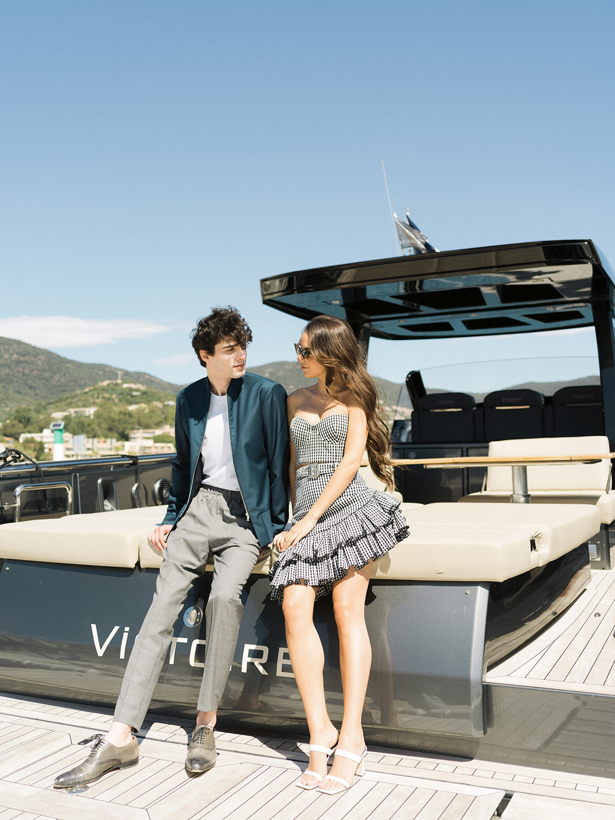 Editorial couple portrait aboard a yacht in the Gulf of Saint-Tropez